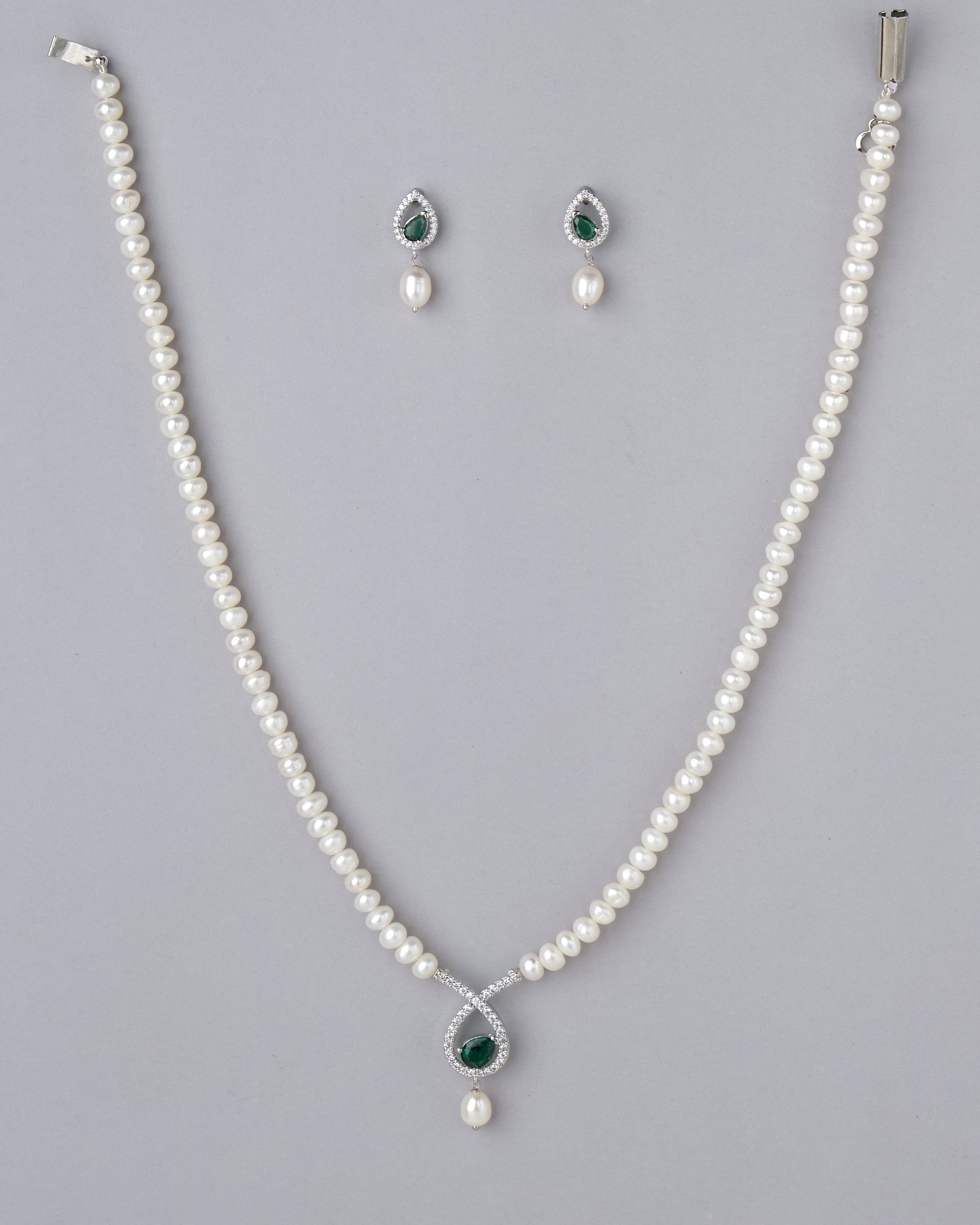 An Lyrical Tear Drop Pearl necklace set by Chandrani Pearls.