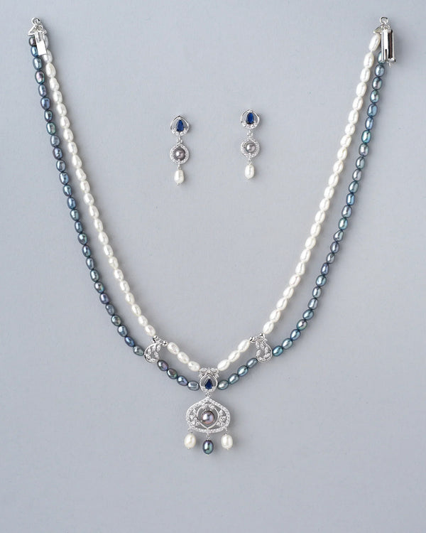Dainty pearl necklace with matching earrings for an elegant finish