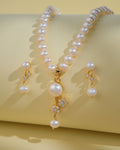 The Simple Pearl Necklace Sets by Chandrani Pearls India, featuring gold and diamond-accented pearls with matching earrings, is showcased on a soft yellow background, ideal for the modern woman.