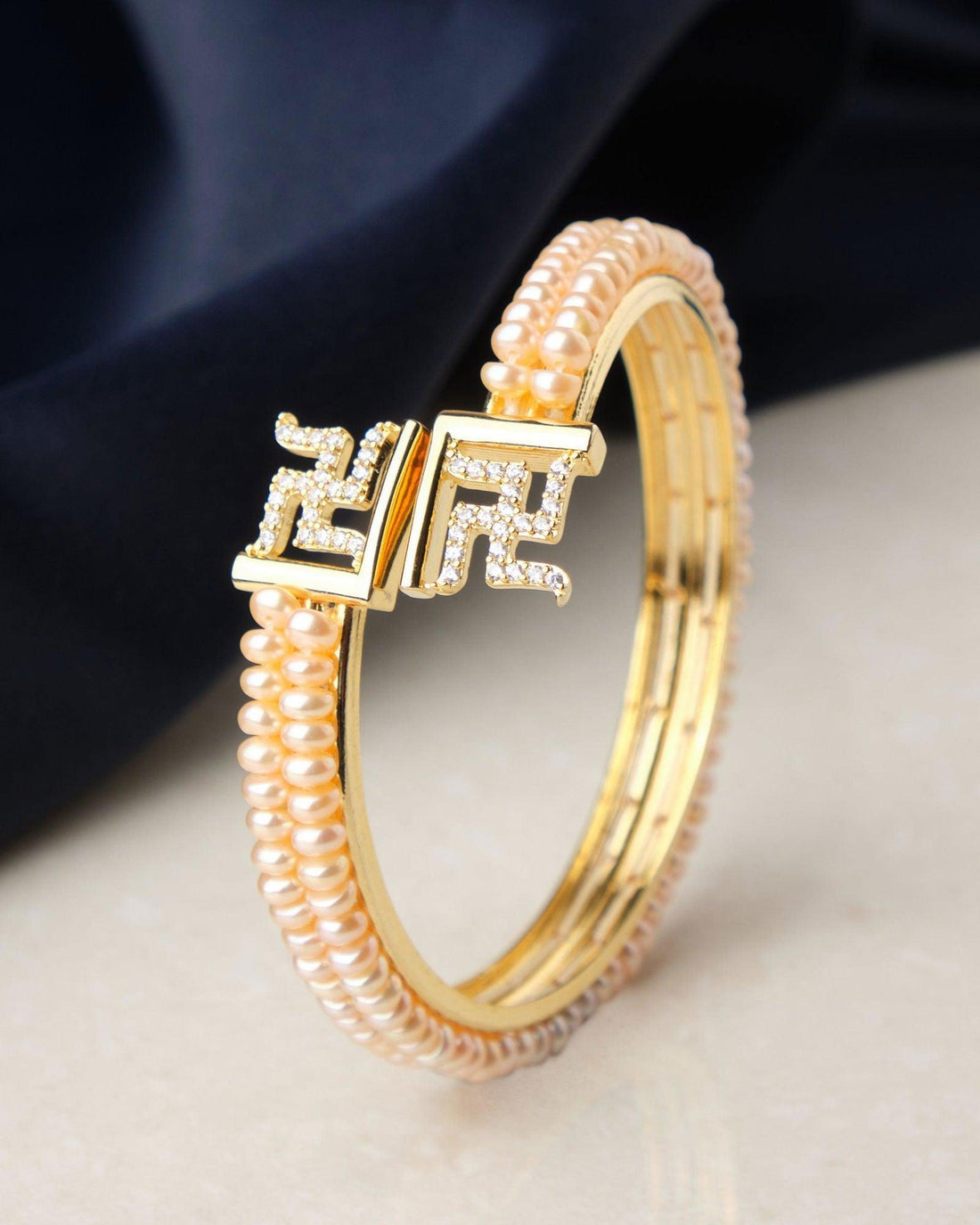 Swastik Stone Studded Pearl Bangle - Chandrani Pearls