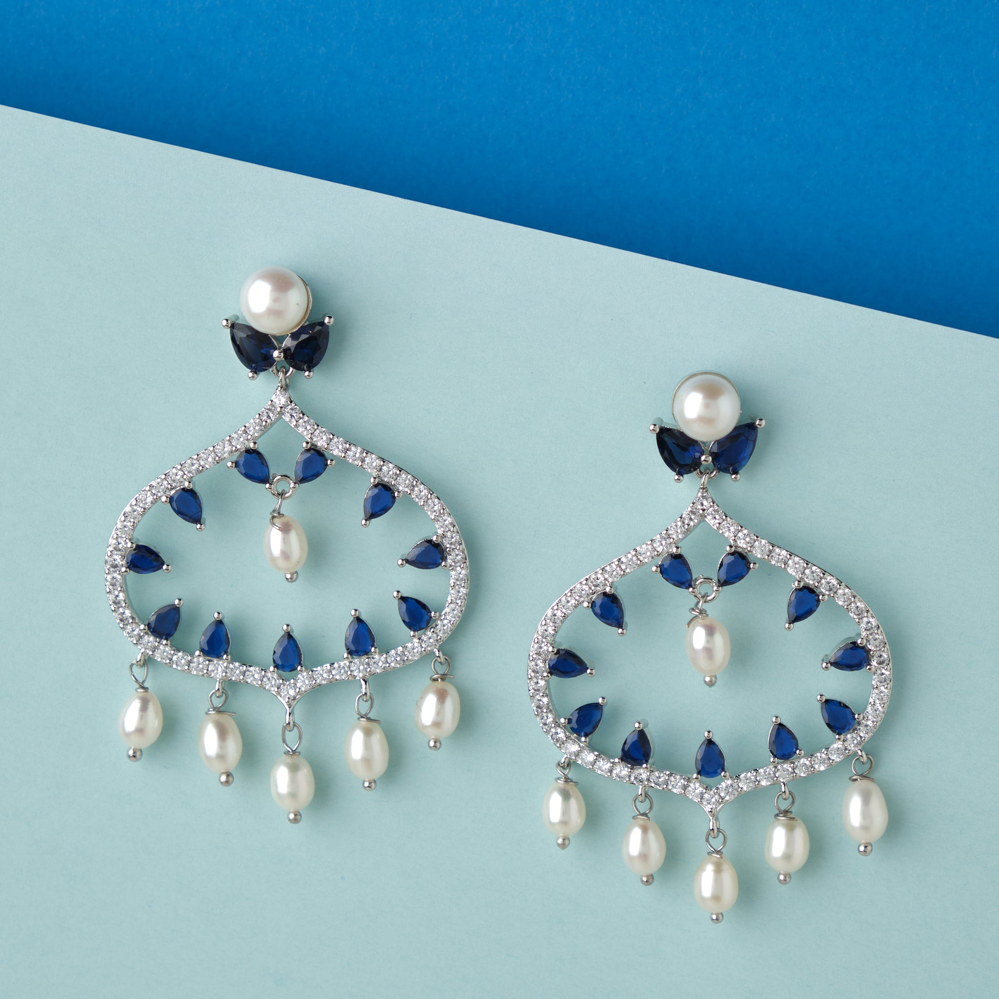 A pair of Ghazala Chand Bali Earrings with pearls and diamonds from Chandrani Pearls.