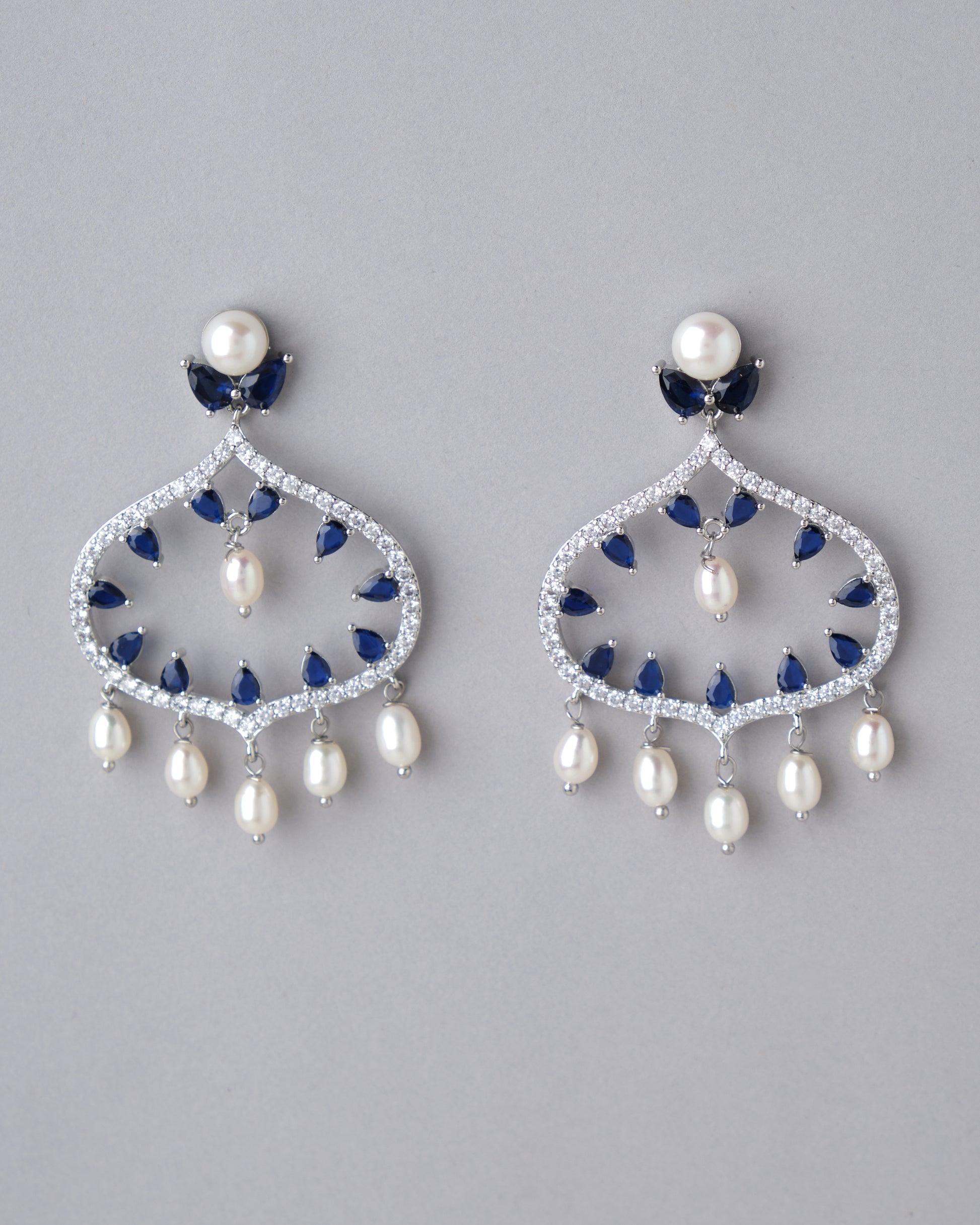 A pair of Ghazala Chand Bali Earrings by Chandrani Pearls with pearls.