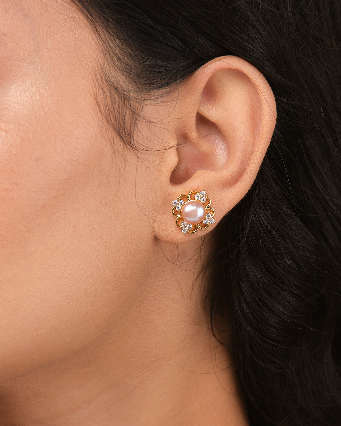 Timeless elegance meets modern sparkle with these Chandrani Pearls pearl and CZ stud earrings, featuring round pearls surrounded by clear gemstones—an ideal choice for everyday wear or special occasions.