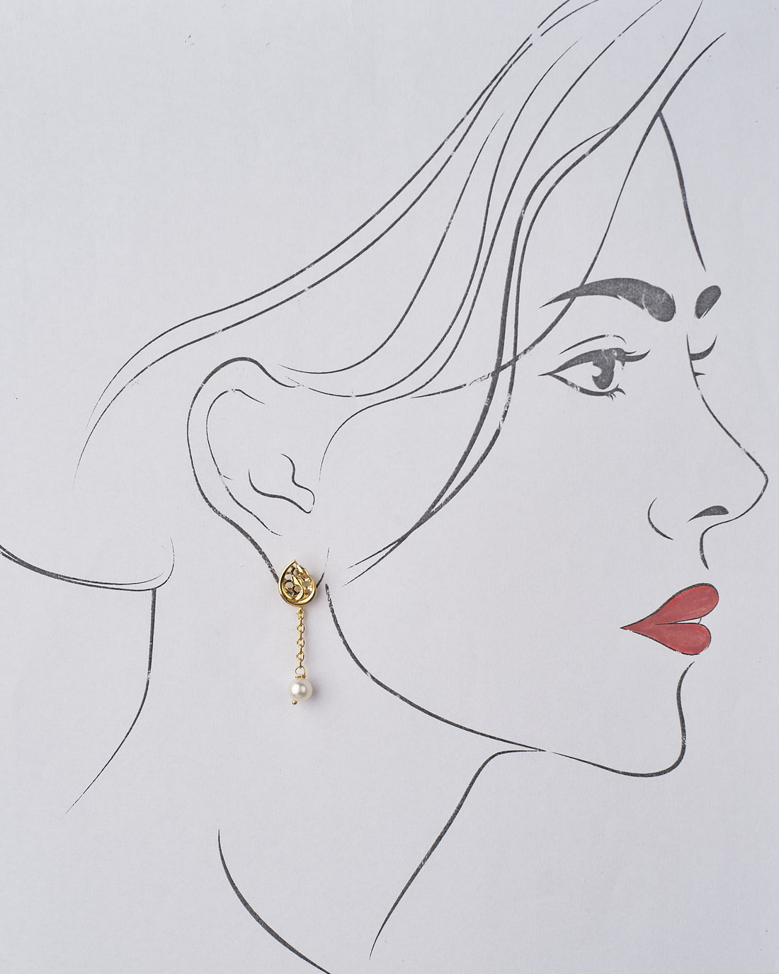 Tulipia 925 Silver Earrings by Chandrani Pearls with pearl drops in front of a red textured backdrop, paired with a red rose.