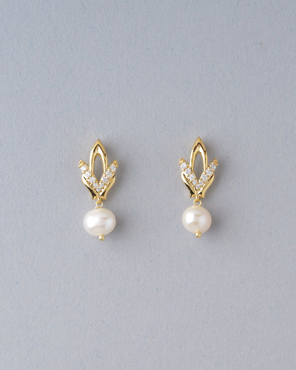 Understated yet dazzling, these pearl and CZ studs add a touch of luxury