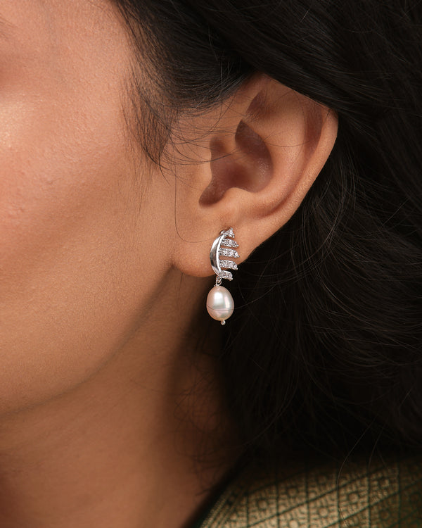 Classic pearl studs are upgraded with a CZ-studded border