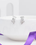 The Brunch Bloom CZ Silver Earrings by Chandrani Pearls feature flower-shaped silver designs with baguette-cut stones and leaf accents—ideal for adding a romantic touch to your casual weekend look.