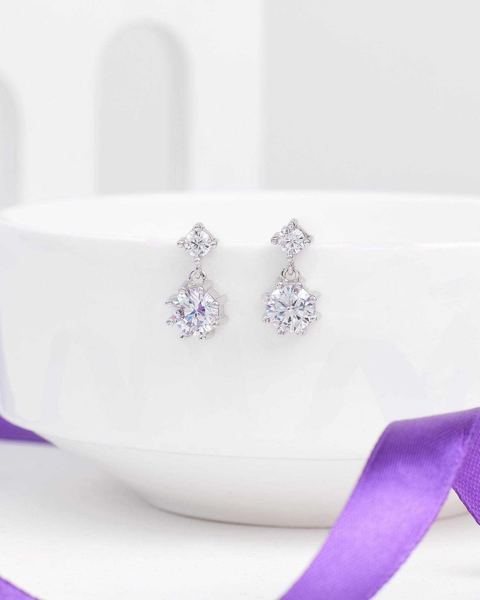 The Elegant Demifine Silver Earrings with Sparkling CZ Stones from Chandrani Pearls offer a refined touch, their shimmering CZ accents adding brilliance to any look.