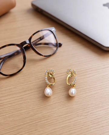 Gold-Tone Interlocking Oval Cubic Zirconia Earrings with Teardrop Pearl Drops