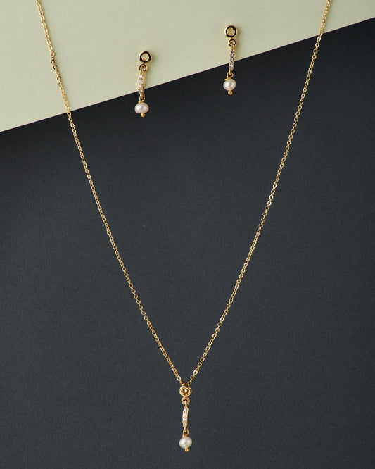 A cute pendant matched with golden polish chain with matching earrings. - Chandrani Pearls